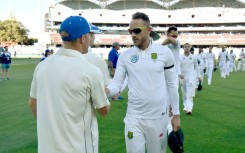 Happier times - Faf du Plessis, then South Africa's captain, (C) shakes hands with Australia' David Warner (L) after the third Test in Adelaide in November 2016. Du Plessis labelled Warner a 'bully' for his role in a dressing room row two years later