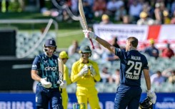 England's Dawid Malan celebrates reaching his century against Australia in Adelaide 