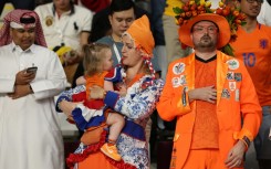 A family of Dutch supporters before their game versus in the US in Qatar