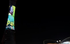 Doha's Aspire Tower is lit up with an image of Pele in his legendary number 10 shirt