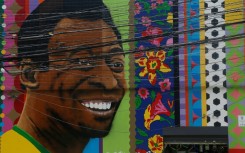 View of a mural depicting Brazilian football legend Pele by artist Aleksandro Reis in Sao Paulo on Saturday