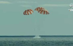 NASA's Orion space capsule, photographed at more than 432,000 km (268,000 miles) from Earth, a record for a habitable vessel, with our planet and the Moon in the background, in November 2022 