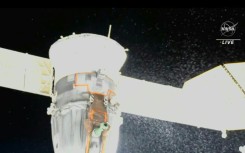 A video grab from a NASA feed shows a coolant leak from the Soyuz MS-22 spacecraft