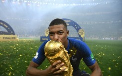 Kylian Mbappe kisses the World Cup trophy after France beat Croatia 4-2 in the 2018 final in Moscow