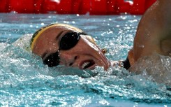 Australia's Lani Pallister became the furst swimmer to win the 400-800-1500m freestyle at a short course world championships  