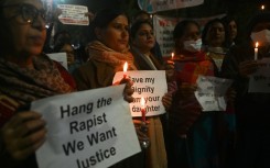 Activists and campaigners hold a candlelight vigil for Jyoti Singh, who was brutally gang-raped and murdered on a New Delhi bus 10 years ago