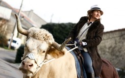 Sabine Rouas and her bull Aston still cause a stir when they go out for a ride in their northern French village