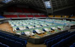 Beds for patients are seen in partitioned rooms at a makeshift fever clinic at a stadium amid the Covid-19 pandemic in Beijing on December 20, 2022.