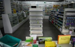 Empty shelves at a pharmacy in Beijing. Cities have been struggling to cope with surging infections since China dropped its zero-Covid policy