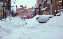 Buffalo has been overwhelmed by a relentless blizzard that has caused at least 27 deaths in the region and trapped many more in their cars and homes