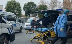 Ambulances transporting patients arrive at Shanghai hospital