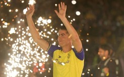 Al-Nassr's new Portuguese forward Cristiano Ronaldo greets fans during his unveiling at the Mrsool Park Stadium in Riyadh