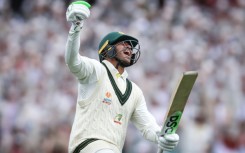 Australia’s Usman Khawaja celebrates reaching his century during day two of the third cricket Test match between Australia and South Africa at the Sydney Cricket Ground (SCG) in Sydney