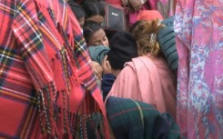 Families of Nepal plane crash victims wait for the release of bodies outside Pokhara hospital