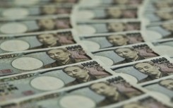 The yen sank back past 131 per dollar after the Bank of Japan left monetary policy unchanged