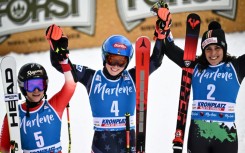 Mikaela Shiffrin (C) won a record-breaking 83rd World Cup race on Tuesday