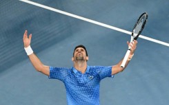 Serbia's Novak Djokovic celebrates his victory against Greece's Stefanos Tsitsipas