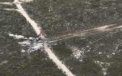 Two pilots made a 'miraculous' escape after their Boeing 737 water-bombing plane crashed and burned while fighting a blaze in remote Western Australia