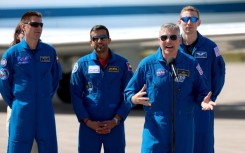 From L-R, Russian cosmonaut Andrey Fedyaev, astronaut Sultan Al-Neyadi of the United Arab Emirates, mission commander Stephen Bowen of NASA and pilot Warren Hoburg of NASA speak to reporters in Cape Canaveral, Florida