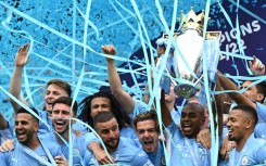 Manchester City lift the Premier League trophy