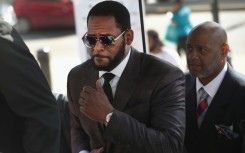 R&B singer R. Kelly, shown here attending a hearing in 2019, was sentenced to 20 years for child sex crimes he was convicted of in Chicago -- he will serve an extra year in prison on top of an earlier 30-year sentence