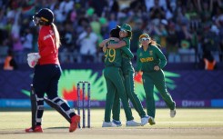 On our way: South Africa's Ayabonga Khaka (2nd left) celebrates after the dismissal of England's Sophie Ecclestone 