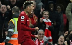 Rout: Roberto Firmino scores the final goal of Liverpool's 7-0 thrashing of Manchester United