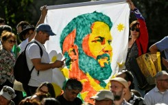 Supporters of Chile's President Gabriel Boric celebrate his first year in office, outside the presidential palace in Santiago, on March 11, 2023