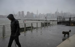 Rain and snow pummeled New York City as a storm gripped the US East Coast