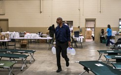 Volunteers work inside an aid center in Rolling Fork, Mississippi, where a tornado killed at least 25 people and flattened entire neighborhoods