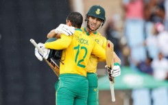 Record-breaking day: South Africa's Quinton de Kock (left) is congratulated by Reeza Hendricks 