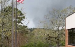 This framegrab from a video provided by Lane Hancock on March 31, 2023 shows a tornado brewing in Little Rock, Arkansas