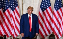 Trump waved to supporters as he arrived at his New York residence on the eve of the historic court hearing