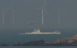 A Chinese navy ship seen off Pingtan island close to Taiwan on Monday. China's military said it had 'successfully completed' its drills around Taiwan