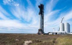 A prototype of Starship, a huge rocket made by SpaceX, sits on a launchpad in Boca Chica, Texas in February 2022