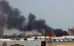 Smoke rises above buildings in Khartoum as the regular army battles paramilitaries at multiple locations around the Sudanese capital