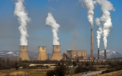 The EU is broadening an emissions trading scheme to more industries and lowering quotas of allowable polluting gases