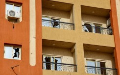 Broken windows at a residential building in Khartoum in the aftermath of fighting