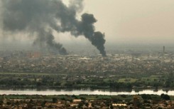 Aerial view of smoke billowing from Khartoum skyline