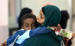 A ferry transporting about 1,900 people arrives at Saudi Arabia's King Faisal Naval base in Jeddah after crossing the Red Sea from Port Sudan with people who fled the fighting