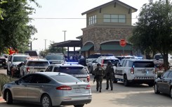 Emergency personnel work the scene of a deadly shooting at a shopping mall in Allen, Texas on May 6, 2023