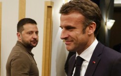 Ukraine's President Volodymyr Zelensky (L) meets France's President Emmanuel Macron on the sidelines of the G7 Leaders' Summit in Hiroshima 