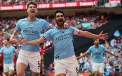 Two good: Ilkay Gundogan (right) scored twice to win the FA Cup for Manchester City