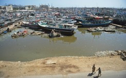 Fishing boats are anchored at a harbour in Karachi, where some people will be evacuated ahead of a cyclone this week