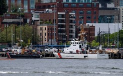 Two US Coast Guard vessels sit in port in Boston Harbor, from where authorities are mounting a search for a submersible that went missing during an expedition to the wreckage of the Titanic in the North Atlantic