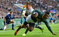 Sibusiso Nkosi (R) scores for South Africa against England in a 2018 Test at Twickenham. 