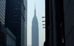 The Empire State Building in New York seen through smoke