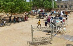 Some of the more than 2.2 million people internally displaced by Sudan's war are staying at a university, turned into a makeshift shelter, in al-Hasaheisa south of Khartoum