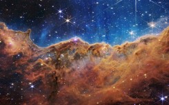 The so-called Cosmic Cliffs of a star-forming region in a part of space called the Carina Nebula, one of the James Webb Space Telescope's first released images