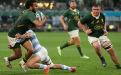 South Africa scrum-half Jaden Hendrikse (L) is tackled during a 2022 Rugby Championship match against Argentina in Durban.
